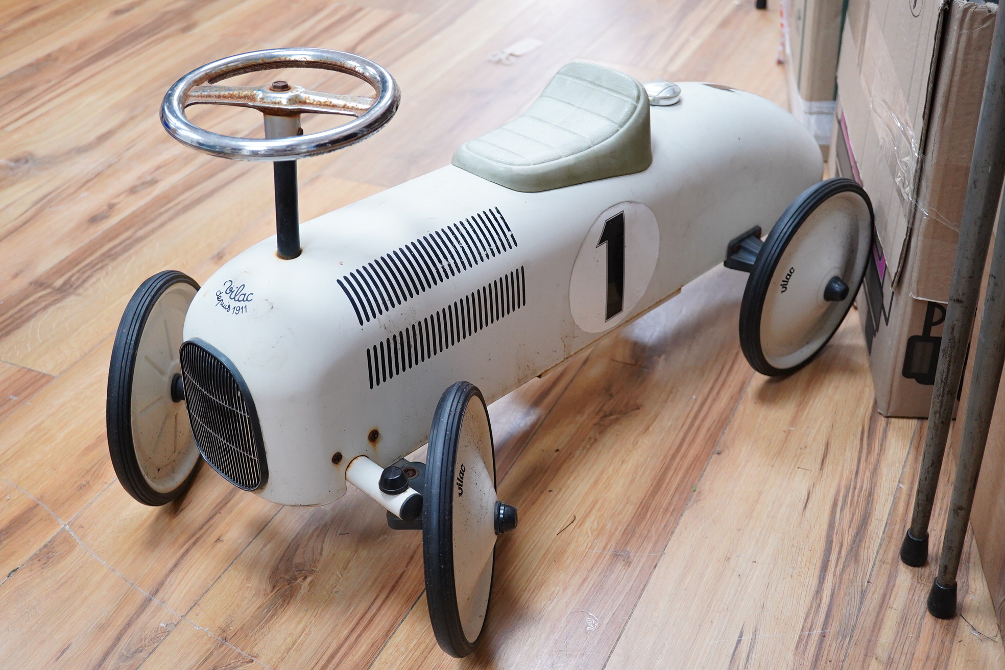 A mid 20th century Vilac child’s tinplate ride on car, body length 74cm